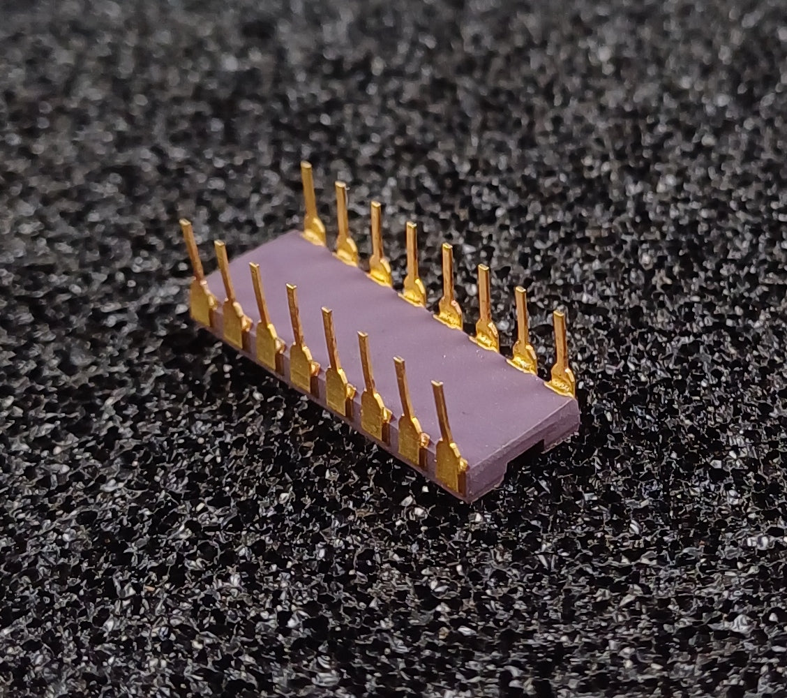AMD C1101A 256-Bit SRAM in a Purple Ceramic Dual Inline Package with Gold Top and Pins